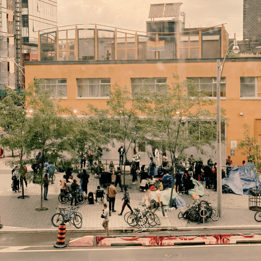 Image of migrants taking refuge on the streets of downtown Toronto